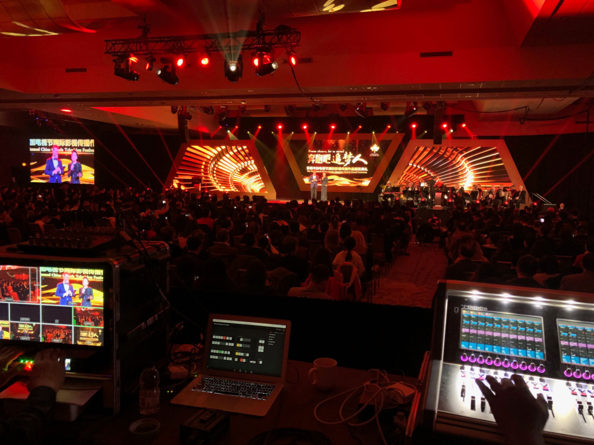 Three P2.6mm LED screens on an award ceremony stage — centre screen plus two angled wings